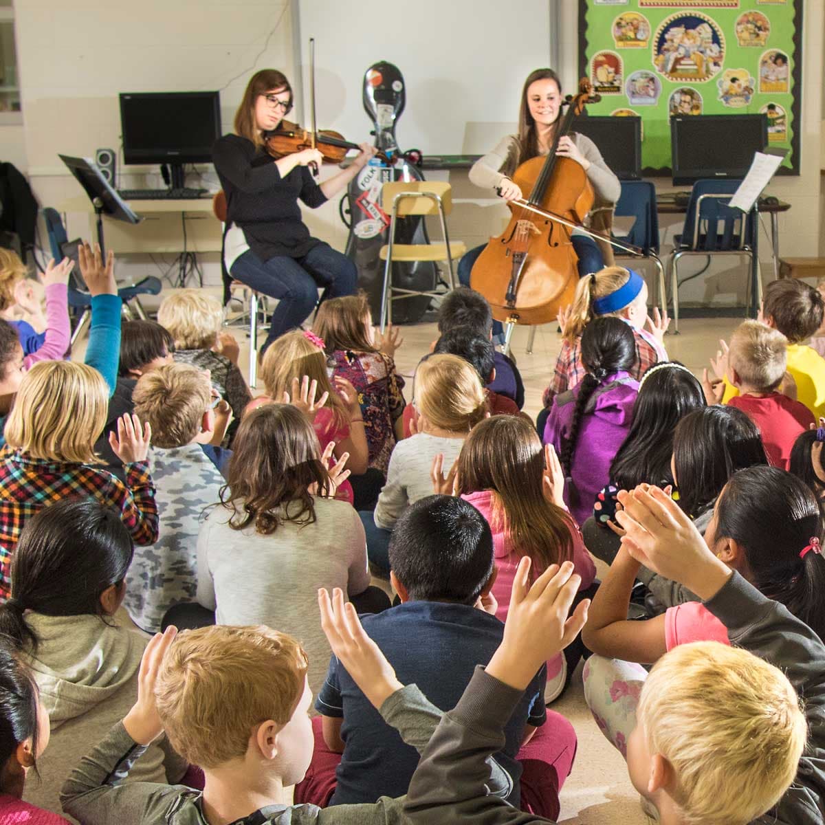 Karla Dietmeyer and Olivia Directs perform as The OK Factor. Part of MPR Classical's Class Notes program at Southgate Elementary School in Austin. ©2016 Jerry M. Olson